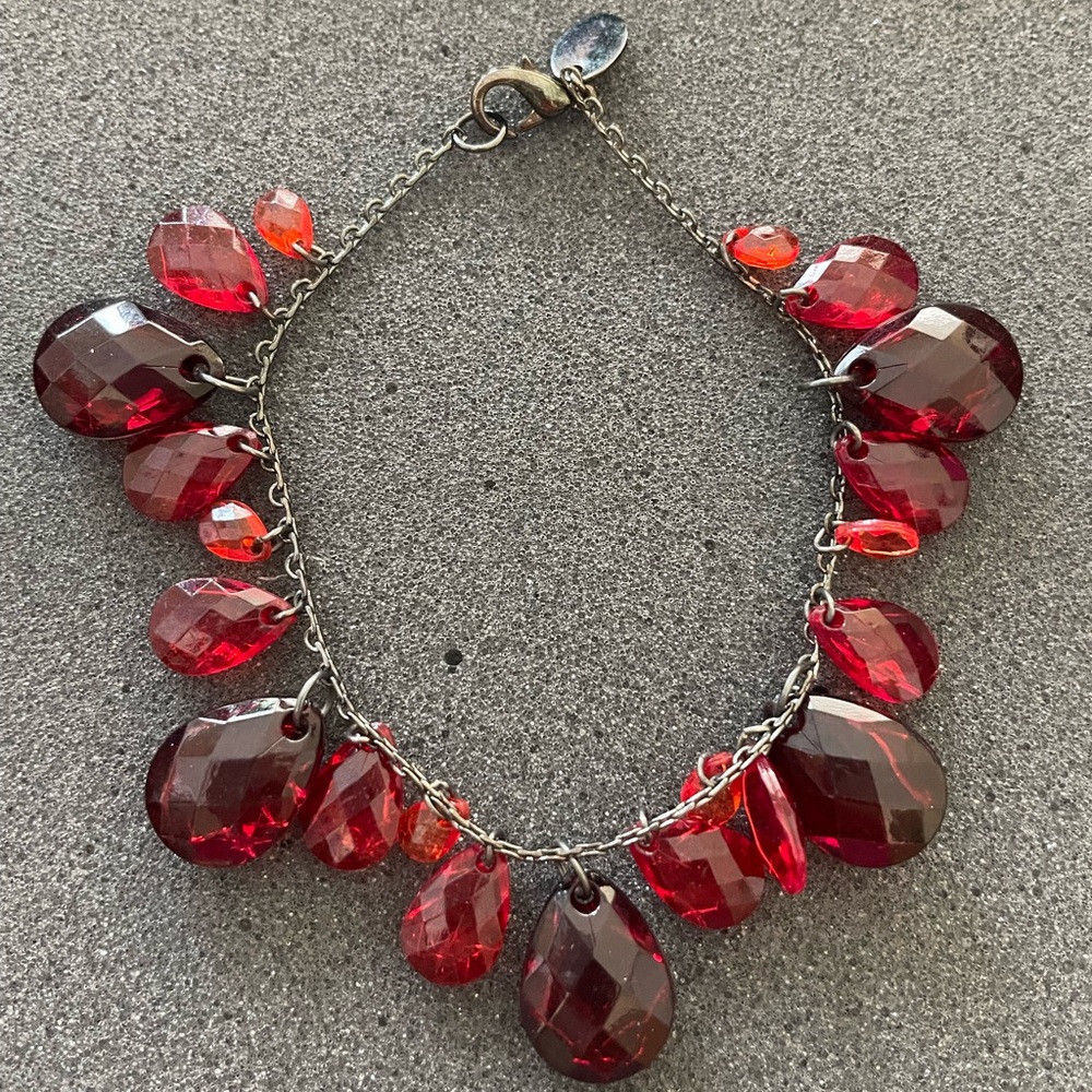 Red hand bracelet.